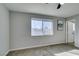 Bedroom features a ceiling fan, carpet flooring and natural light from window at 4505 Providence Ln, Las Vegas, NV 89107