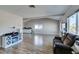 Open-concept living room featuring wood floors, vaulted ceilings, and many windows at 4505 Providence Ln, Las Vegas, NV 89107