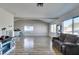 Bright living room featuring wood floors, vaulted ceilings, and many windows at 4505 Providence Ln, Las Vegas, NV 89107