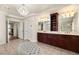 Bathroom boasting dual sinks, chandelier, and access to shower and toilet rooms at 4542 Grey Spencer Dr, Las Vegas, NV 89141