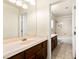 Bathroom with a large mirror, double sink vanity, and shower over tub at 4542 Grey Spencer Dr, Las Vegas, NV 89141