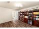 Spacious bedroom with a large built-in bookcase and wood-look floors at 4542 Grey Spencer Dr, Las Vegas, NV 89141