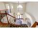 Foyer with a staircase, chandelier, grand entry doors and decorative stone floor at 4542 Grey Spencer Dr, Las Vegas, NV 89141