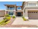 Charming home featuring a three-car garage, desert landscaping, and a brick walkway to the main entrance at 4542 Grey Spencer Dr, Las Vegas, NV 89141