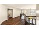 Second floor hallway with wood floors, wainscoting, and decorative wrought iron railing at 4542 Grey Spencer Dr, Las Vegas, NV 89141