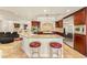 Bright kitchen with granite countertops, stainless steel appliances, and a large center island with seating at 4542 Grey Spencer Dr, Las Vegas, NV 89141
