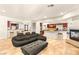 Expansive living area featuring a fireplace, open floor plan, and seamless flow to the adjacent kitchen at 4542 Grey Spencer Dr, Las Vegas, NV 89141