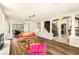 Bright and airy living room with hardwood floors, fireplace, staircase, and elegant decor at 4542 Grey Spencer Dr, Las Vegas, NV 89141