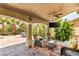 Relaxing covered patio seating area with ceiling fan and outdoor TV at 4542 Grey Spencer Dr, Las Vegas, NV 89141