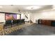 Home theater with bar area, big screen, projector, and comfortable seating at 4542 Grey Spencer Dr, Las Vegas, NV 89141