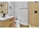 Updated bathroom featuring a modern vanity, white toilet, and a beautifully tiled walk-in shower at 4769 Via Renaldo, Las Vegas, NV 89103