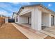 A house featuring a carport and a gray roll-up garage door at 4769 Via Renaldo, Las Vegas, NV 89103