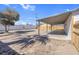 Spacious backyard with a covered patio and a newly-constructed wooden fence at 4825 Randall Dr, Las Vegas, NV 89122