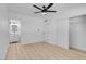 Bedroom with light wood flooring, and a view of the bathroom at 4825 Randall Dr, Las Vegas, NV 89122