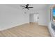 Bright living room with light wood floors and a view of the kitchen at 4825 Randall Dr, Las Vegas, NV 89122