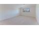 Bright, spacious bedroom with plush carpeting and a window at 5101 Breakers Ln, Las Vegas, NV 89113