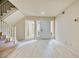 Inviting foyer with staircase and entry door surrounded by sidelight windows at 5101 Breakers Ln, Las Vegas, NV 89113