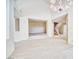 Spacious living room featuring tile flooring and access to the staircase at 5101 Breakers Ln, Las Vegas, NV 89113