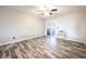 Bright bedroom featuring wood-look floors and a sliding glass door to the outside at 5326 Swenson St # 61, Las Vegas, NV 89119