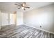 Large bedroom with stylish wood-look flooring and a ceiling fan at 5326 Swenson St # 61, Las Vegas, NV 89119