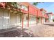 Apartment building exterior with red trim, patios, and drought resistant landscaping at 5326 Swenson St # 61, Las Vegas, NV 89119