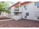 Multi-level apartment building with outdoor patios and rocky landscaping at 5326 Swenson St # 61, Las Vegas, NV 89119