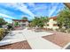 Inviting community area with picnic tables, barbecue grills, and mature trees at 5326 Swenson St # 61, Las Vegas, NV 89119