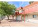 Two-story condo features red painted balconies, matching roof, and desert landscaping in a residential neighborhood at 5326 Swenson St # 61, Las Vegas, NV 89119