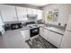 Well-equipped kitchen featuring updated white cabinetry, stainless steel appliances, and modern countertops at 5326 Swenson St # 61, Las Vegas, NV 89119