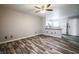 Inviting living room featuring stylish wood-look floors and a modern ceiling fan at 5326 Swenson St # 61, Las Vegas, NV 89119