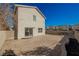 Spacious backyard with brick patio, desert landscaping, and block wall at 5357 Hammond Ct, Las Vegas, NV 89110