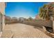 Large backyard with brick patio, desert landscaping, and block wall at 5357 Hammond Ct, Las Vegas, NV 89110