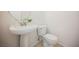 Bathroom features a sleek pedestal sink and a classic white toilet at 5357 Hammond Ct, Las Vegas, NV 89110