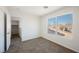 Bedroom with carpet and a large window at 5357 Hammond Ct, Las Vegas, NV 89110