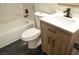 Modern bathroom featuring a wood vanity, toilet, and shower at 5825 Bent Branch Ln, Las Vegas, NV 89142