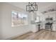 Dining area with updated kitchen and modern lighting at 5825 Bent Branch Ln, Las Vegas, NV 89142