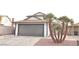 Charming two-story home featuring a well-maintained lawn and two-car garage at 5825 Bent Branch Ln, Las Vegas, NV 89142