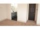 Hallway leading to the bathroom and bedroom featuring neutral walls and plush carpeting at 5825 Bent Branch Ln, Las Vegas, NV 89142