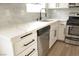 Modern kitchen featuring quartz countertops, stainless steel appliances, and stylish backsplash at 5825 Bent Branch Ln, Las Vegas, NV 89142