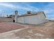 Backyard featuring a mix of concrete and rock landscaping, ideal for low maintenance at 613 W Victory Rd, Henderson, NV 89015