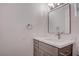 Bathroom with modern vanity, sink, mirror, and neutral color scheme at 613 W Victory Rd, Henderson, NV 89015