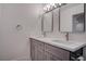 Bright bathroom featuring double sinks, modern fixtures, and a clean, contemporary design at 613 W Victory Rd, Henderson, NV 89015