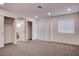 Carpeted bedroom leading into bathroom with walk-in closet at 613 W Victory Rd, Henderson, NV 89015