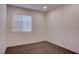 Neutral bedroom with carpet flooring, white walls, and a window with blinds at 613 W Victory Rd, Henderson, NV 89015