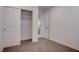 Bedroom featuring carpet, white walls, closet, and door leading to another room at 613 W Victory Rd, Henderson, NV 89015