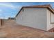 Side view of home exterior featuring stucco siding and a low-maintenance landscape at 613 W Victory Rd, Henderson, NV 89015