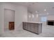 A stylish kitchen features gray cabinets, white countertop, and modern lighting at 613 W Victory Rd, Henderson, NV 89015