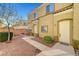 Charming townhome featuring a well-maintained front yard, walkway, and desert landscaping at 6320 Desert Leaf St # 101, North Las Vegas, NV 89081