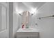 Modern half bathroom with stylish mirror, lighting, and sink at 6320 Desert Leaf St # 101, North Las Vegas, NV 89081