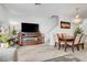 Inviting living room with a decorative fireplace, staircase, and wood-style flooring at 6320 Desert Leaf St # 101, North Las Vegas, NV 89081